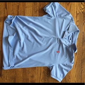 Light blue, polo Ralph Lauren collared shirt.